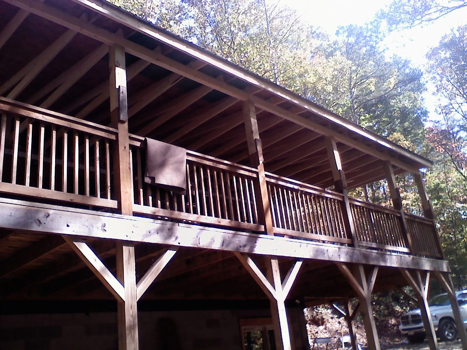 Timber framing under a new elevated porch and deck — Roof Leak Repair in Southwick by Roofing Brothers